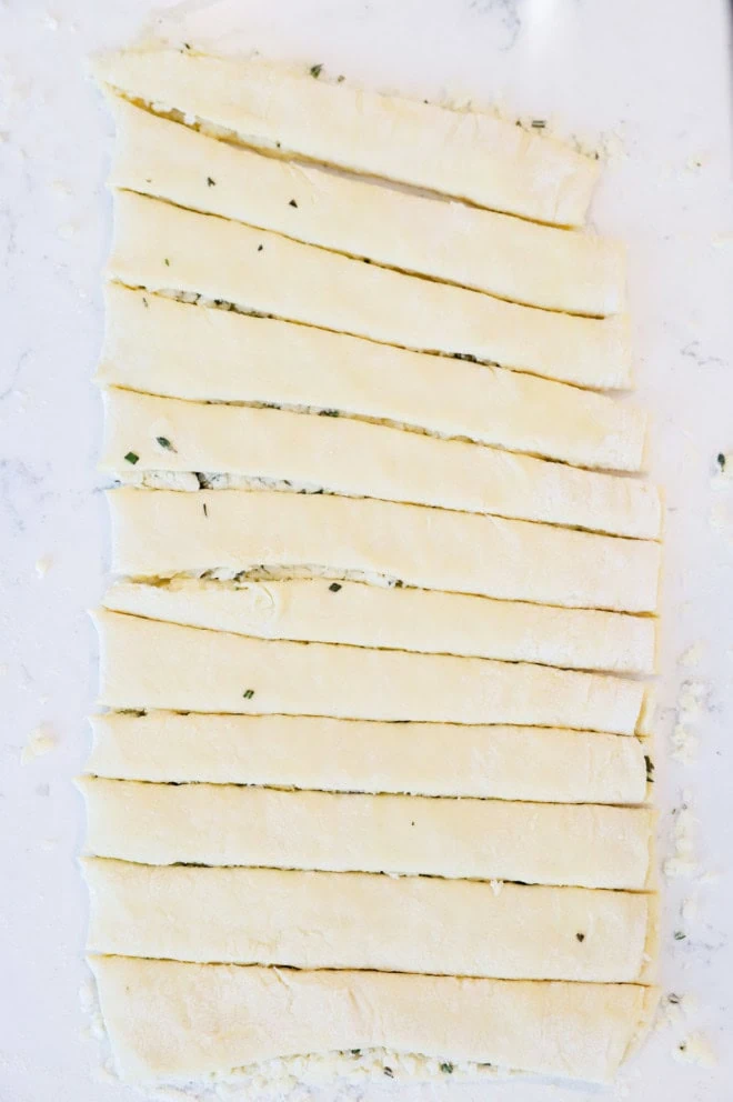 making cheese twists dough cut into strips