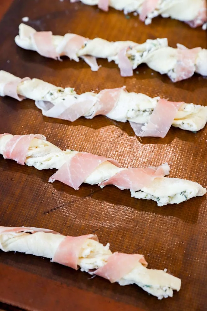 preppe prosciutto cheese twists on baking sheet before baking