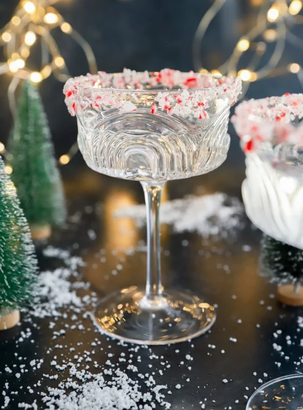 peppermint martini in coupe glass with little trees and lights