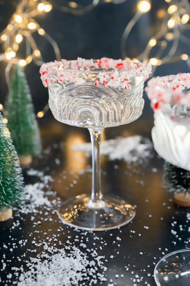 peppermint martini in coupe glass with little trees and lights