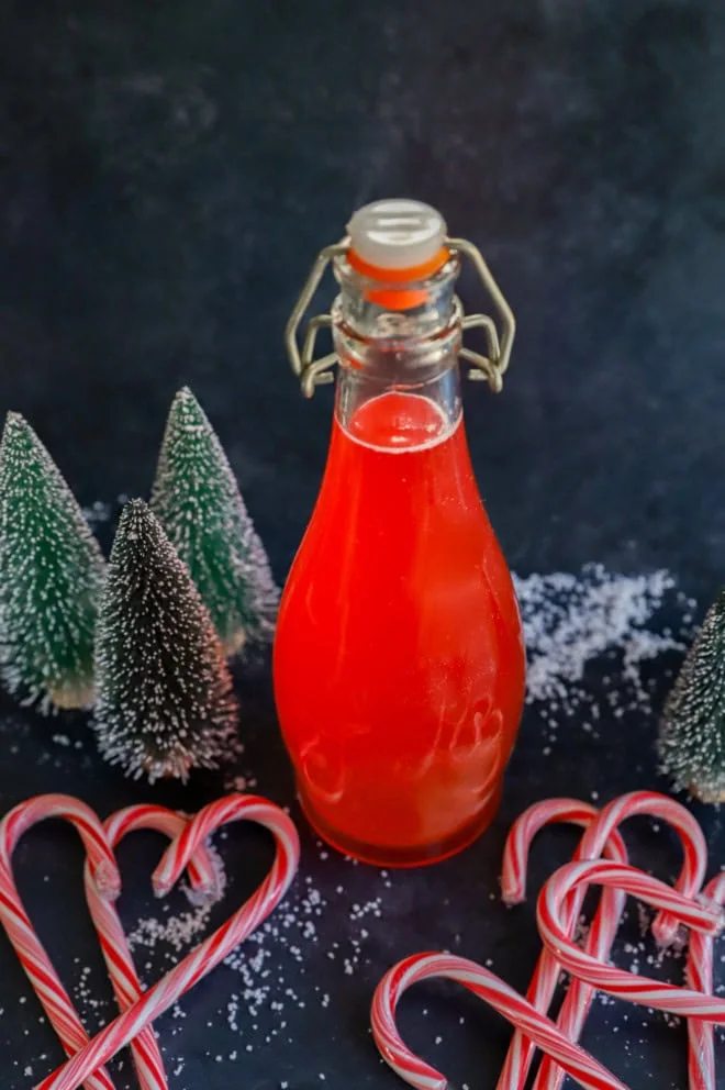 bottle of peppermint vodka for a gift with candy canes