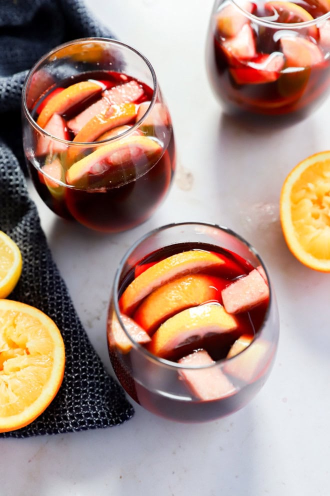 red sangria in wine glasses with fresh fruit