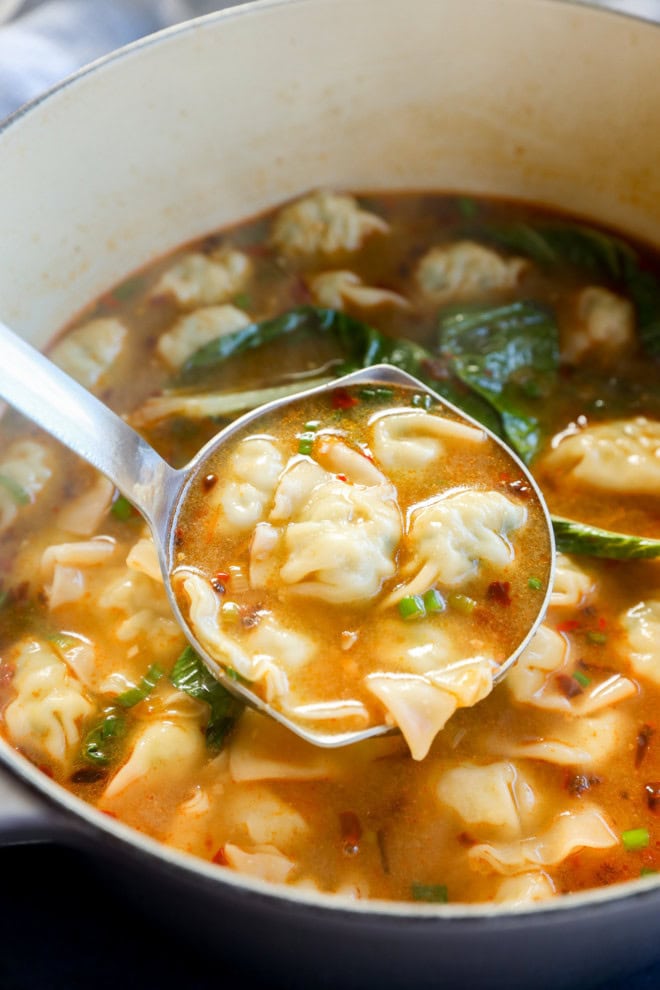 easy asian broth with ladle and bok choy