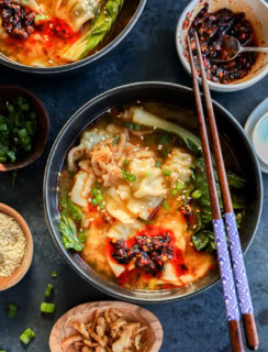 30 minute dumpling soup in bowls with chopsticks and chili crisp