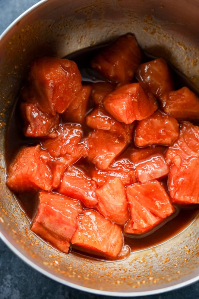 salmon bites in bowl with marinade