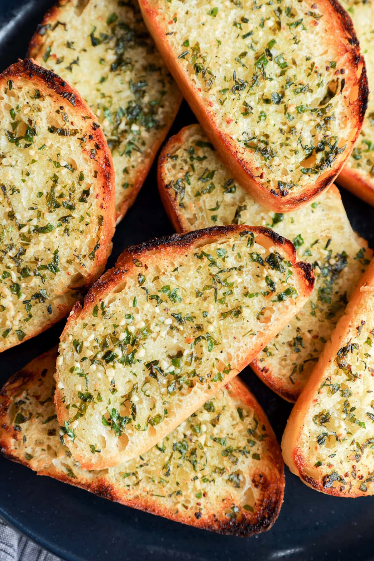 easy fresh herb bread slices on a plate with butter