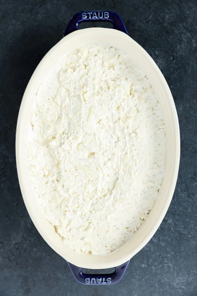 baked goat cheese appetizer in baking dish before baking