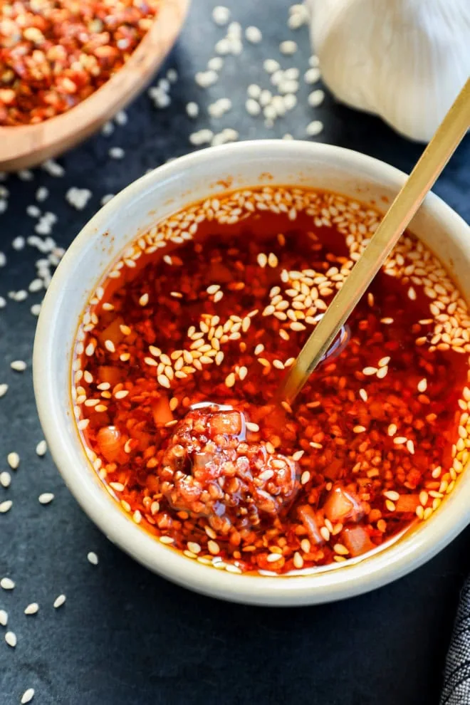 spoon in bowl of chili garlic oil recipe