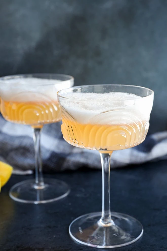 easy cocktail with egg white foam on top with linen