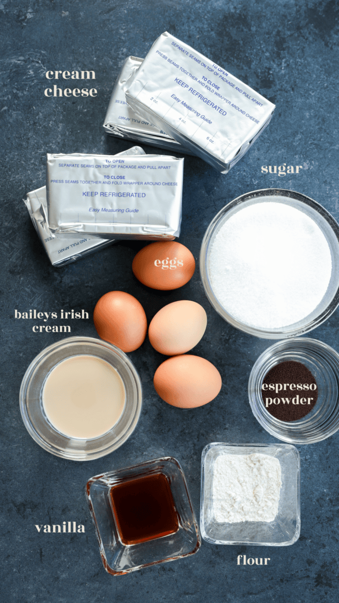 Baileys cheesecake ingredients in bowls with text labels