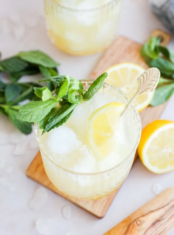 cocktail glasses with bourbon smash cocktails in them