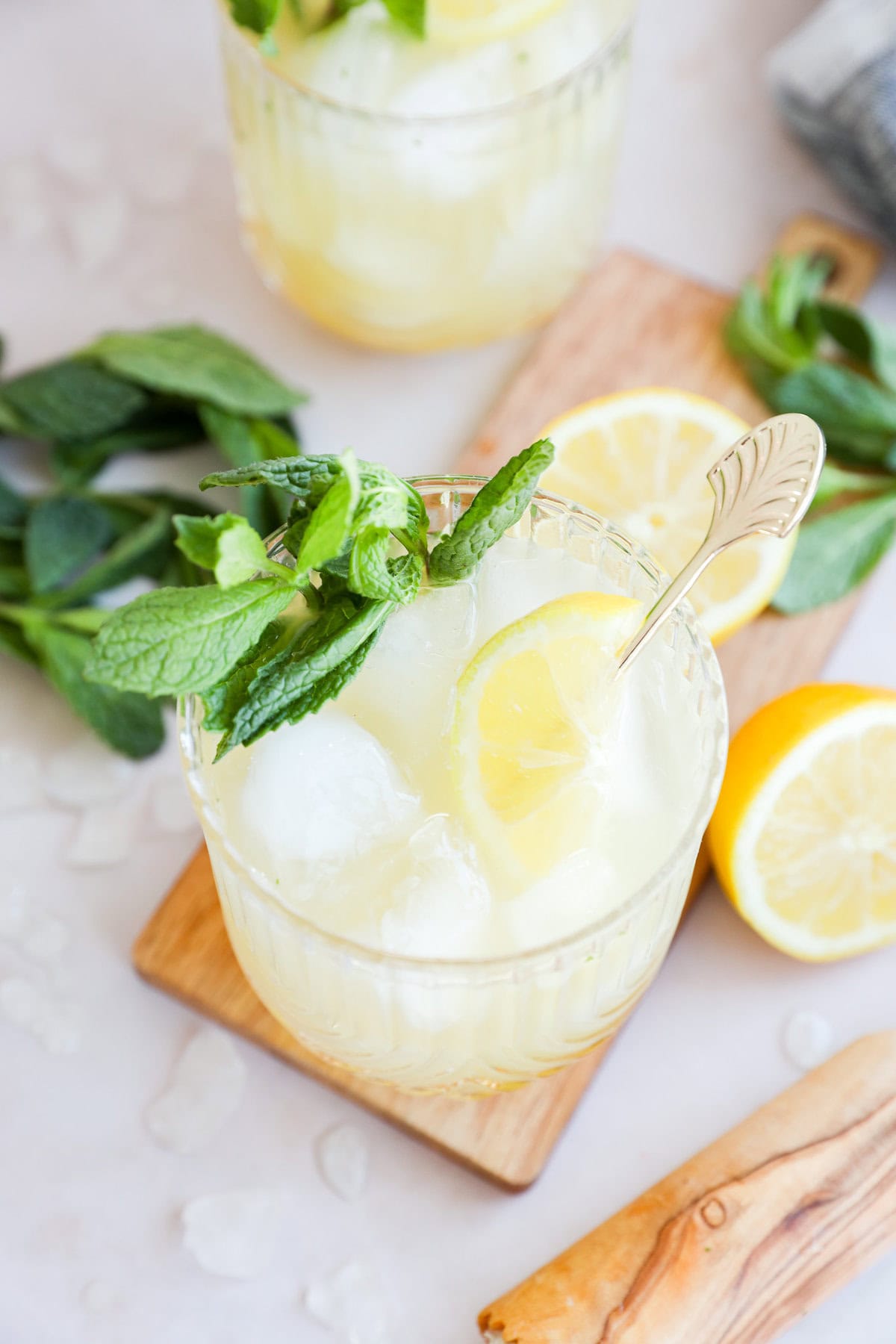 cocktail glasses with bourbon smash cocktails in them