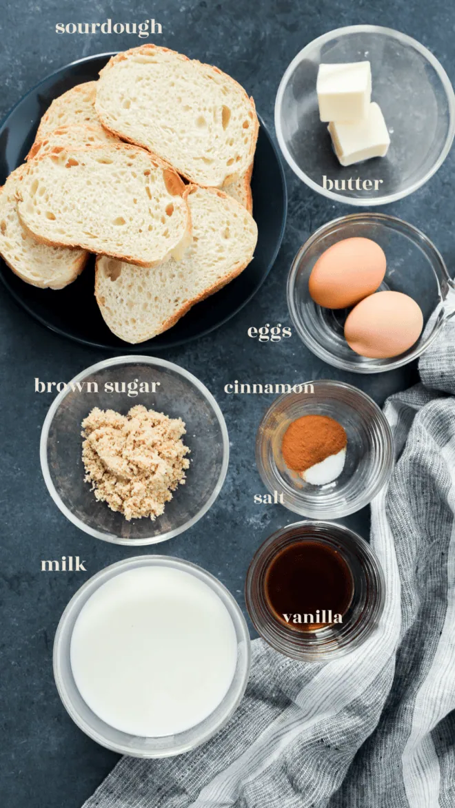 sourdough french toast ingredients in bowls with text labels