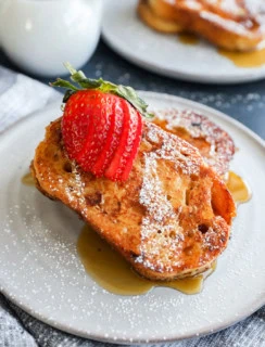 easy breakfast on a plate with maple syrup and fresh fruit